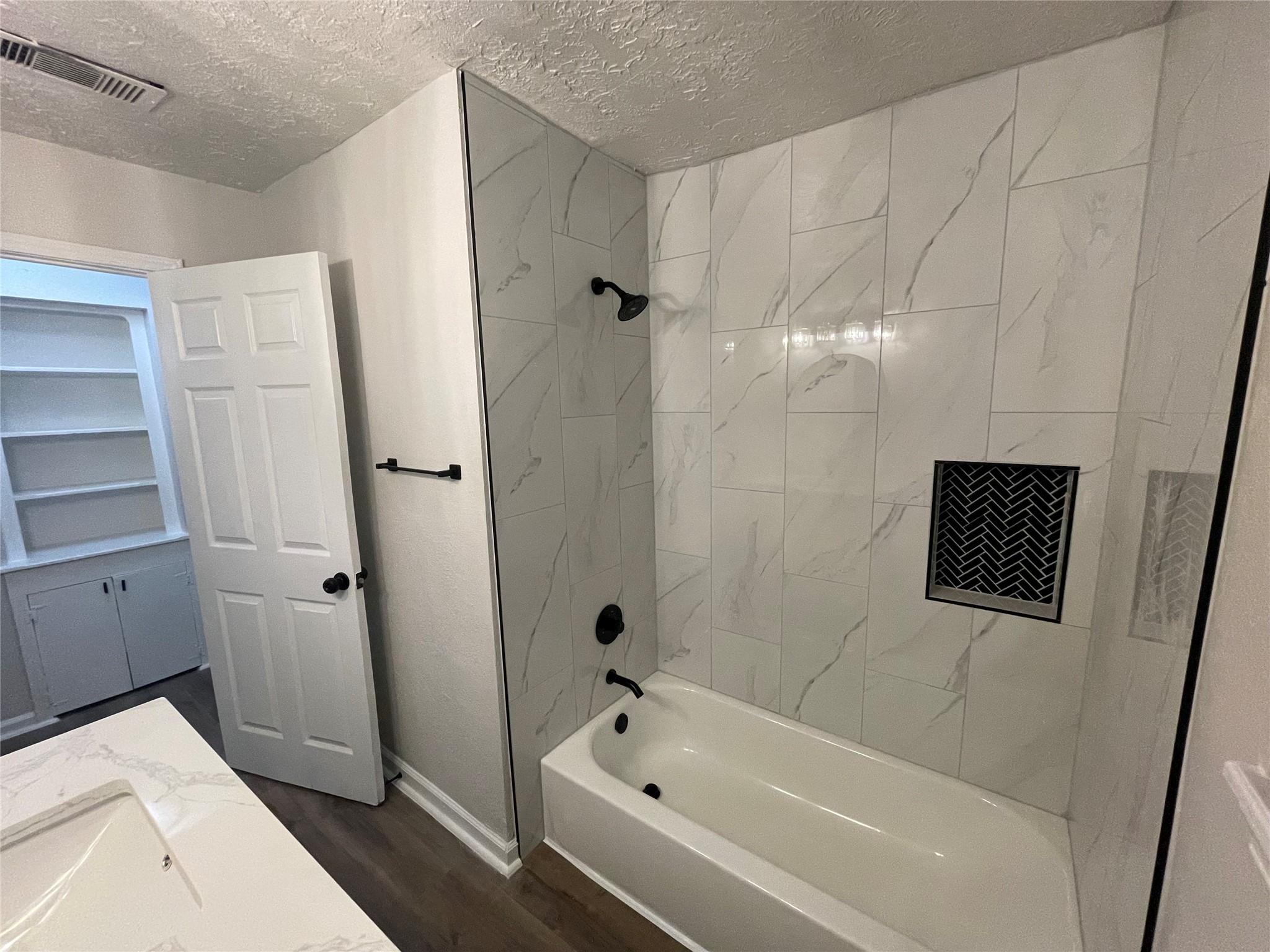6003 Westover Street Houston, TX 77033 - Photo 12 of 19 a bathroom with a bathtub and shower