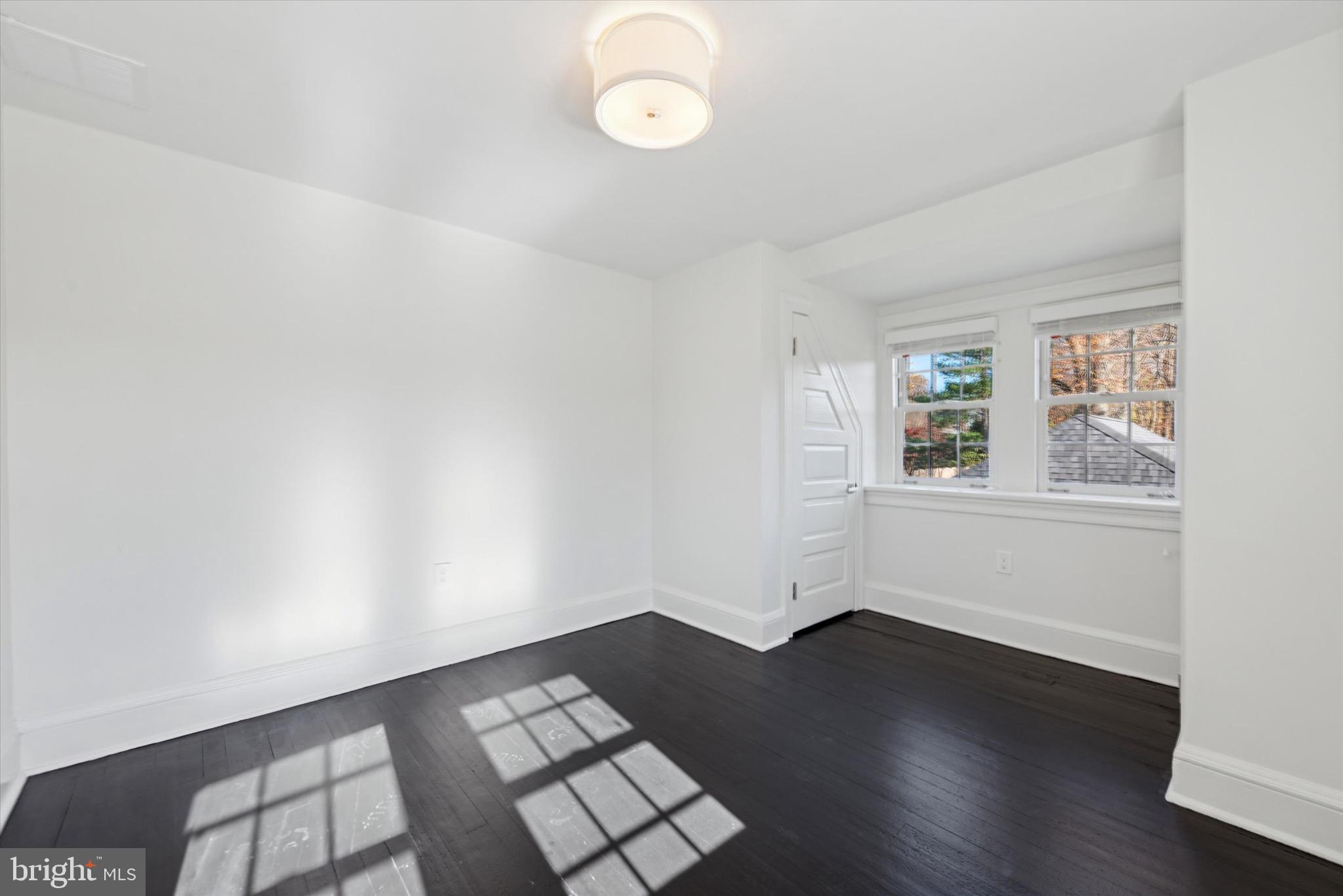 767-769 Newtown Road Villanova, PA 19085 - Photo 22 of 26 an empty room with wooden floor and windows
