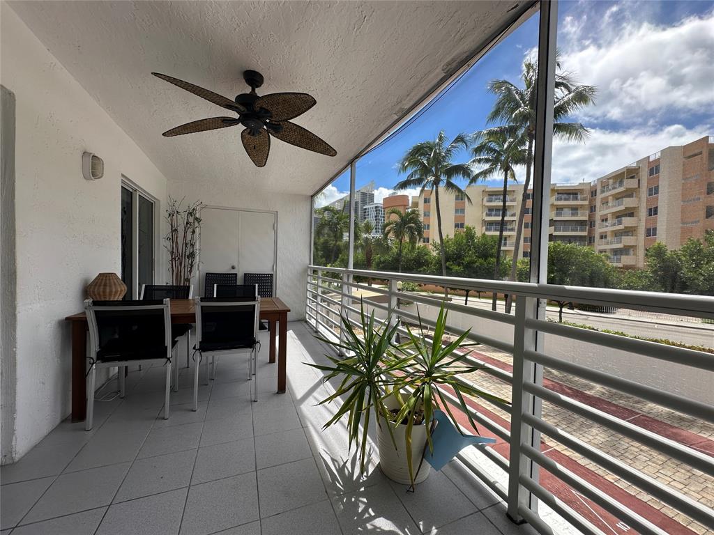 17801 North Bay Road, Unit 212 Sunny Isles Beach, FL 33160 - Photo 18 of 48 a view of a porch with furniture