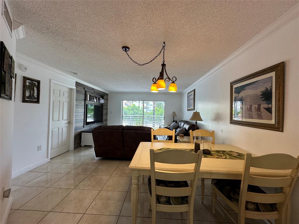 17801 North Bay Road, Unit 212 Sunny Isles Beach, FL 33160 - Photo 34 of 48 a view of a dining room with furniture