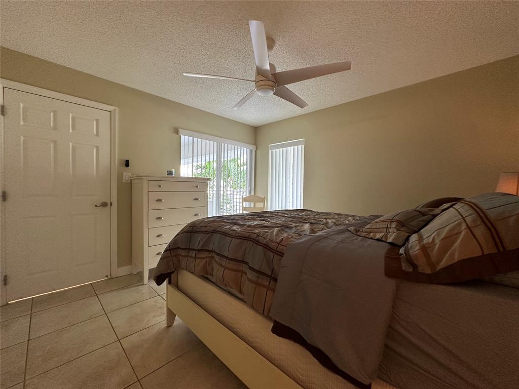 17801 North Bay Road, Unit 212 Sunny Isles Beach, FL 33160 - Photo 36 of 48 a bedroom with a bed and window