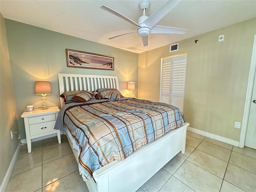 17801 North Bay Road, Unit 212 Sunny Isles Beach, FL 33160 - Photo 38 of 48 a bedroom with a bed and a window