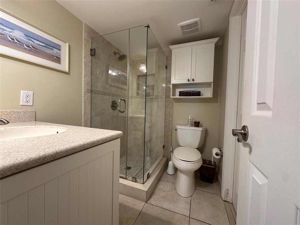 17801 North Bay Road, Unit 212 Sunny Isles Beach, FL 33160 - Photo 40 of 48 a bathroom with a granite countertop toilet and a sink
