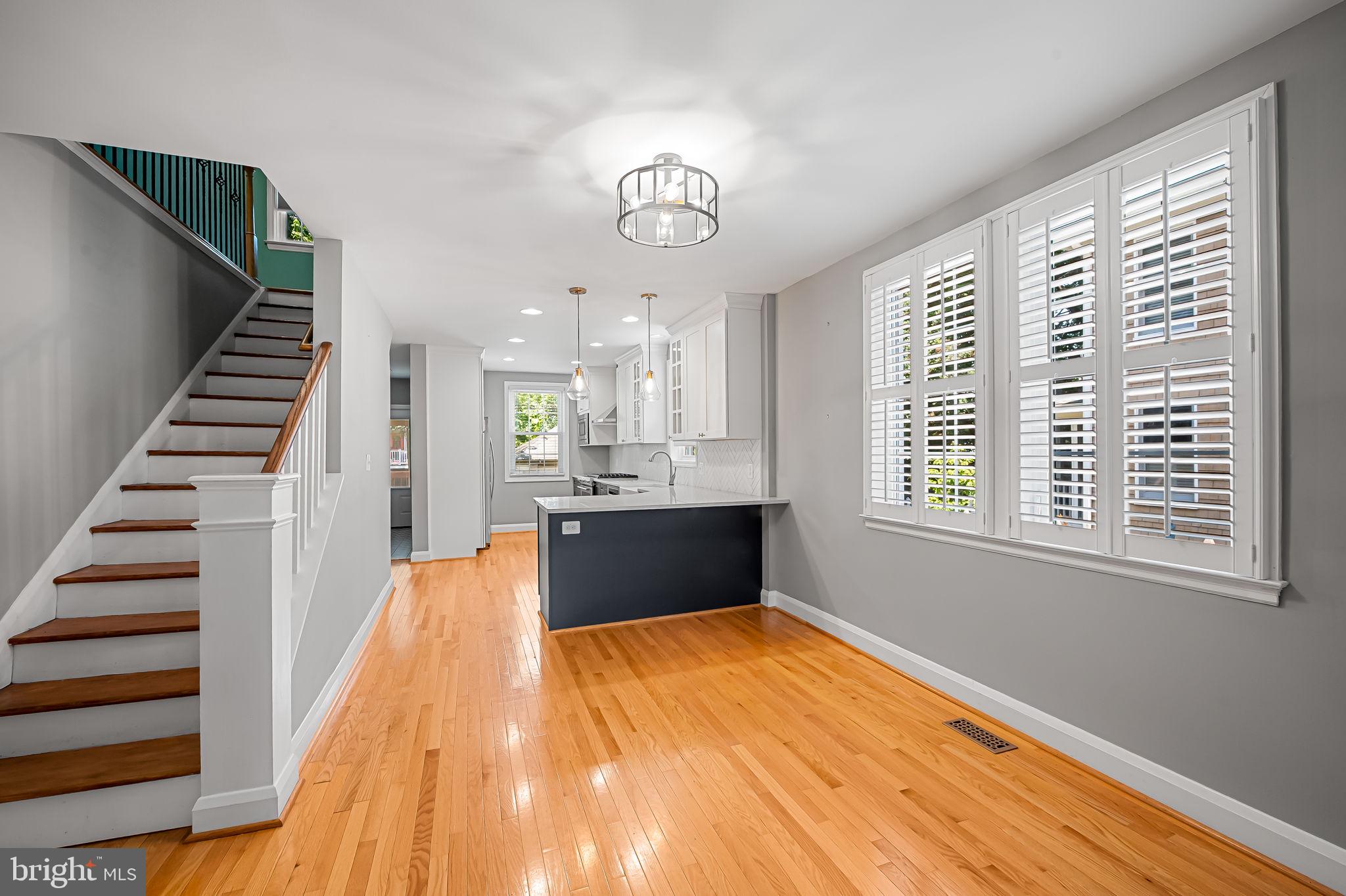 526 Dunkirk Road Baltimore, MD 21212 - Photo 11 of 44 a view of an empty room with wooden floor and a window