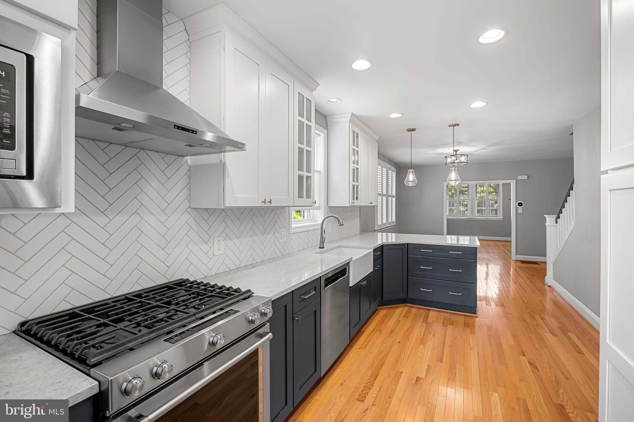 526 Dunkirk Road Baltimore, MD 21212 - Photo 16 of 44 a kitchen with stainless steel appliances granite countertop a stove a sink and a refrigerator