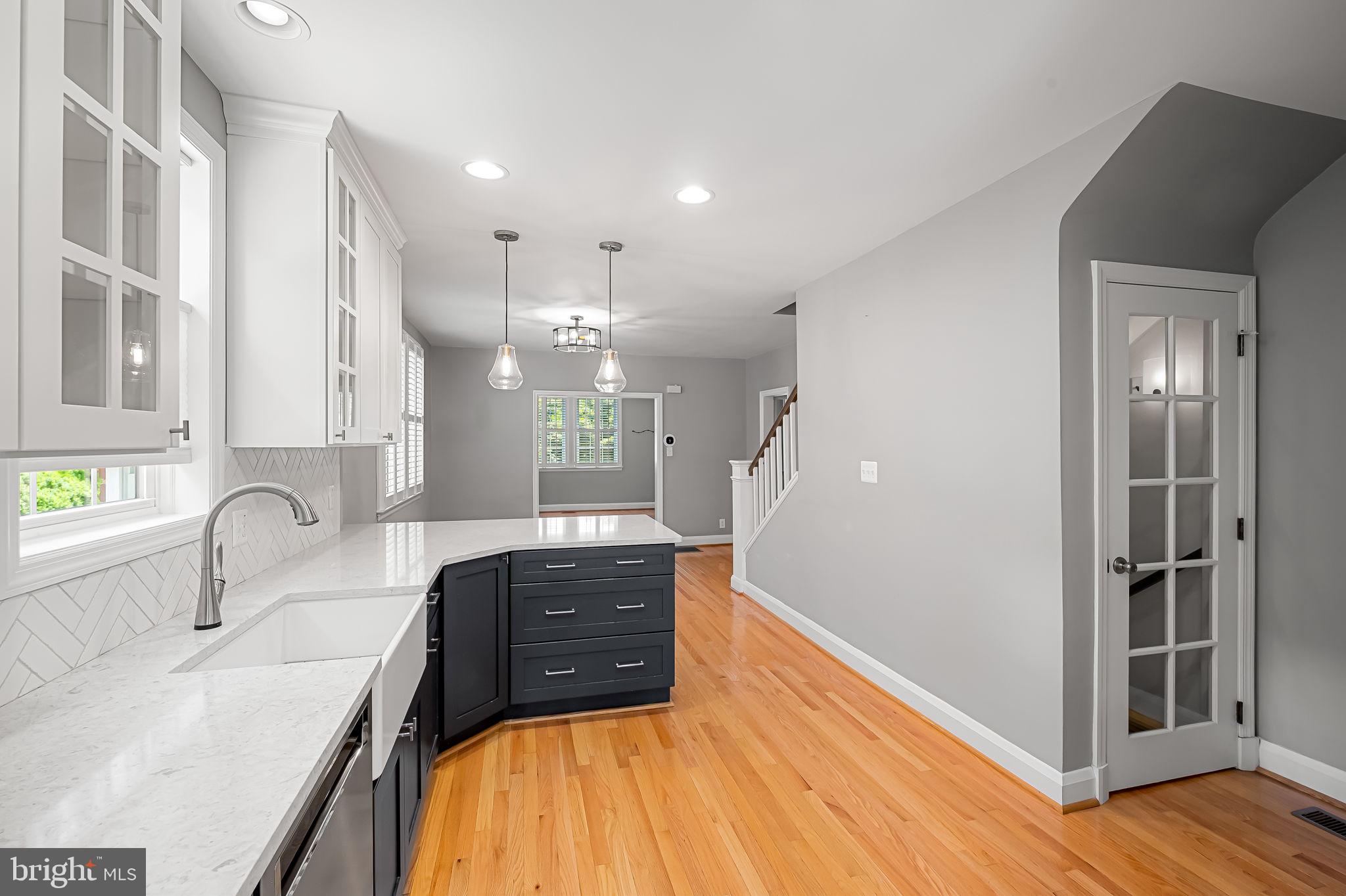 526 Dunkirk Road Baltimore, MD 21212 - Photo 17 of 44 a kitchen with stainless steel appliances a sink cabinets and wooden floor
