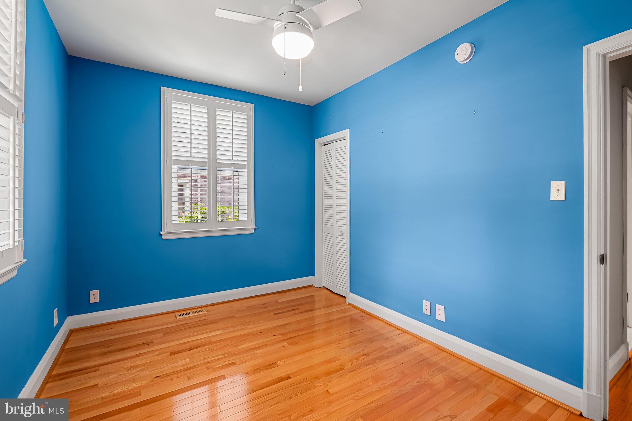 526 Dunkirk Road Baltimore, MD 21212 - Photo 20 of 44 an empty room with windows and fan