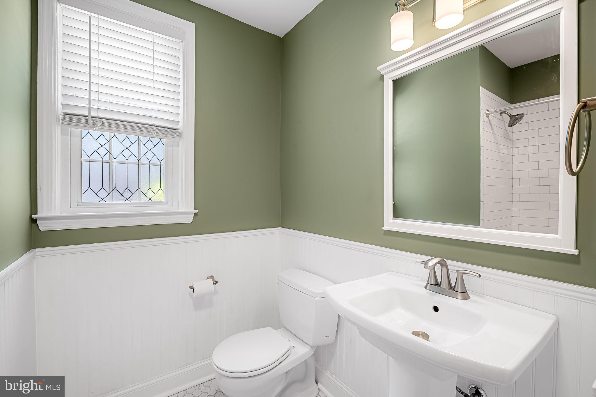 526 Dunkirk Road Baltimore, MD 21212 - Photo 22 of 44 a bathroom with a sink a toilet and shower