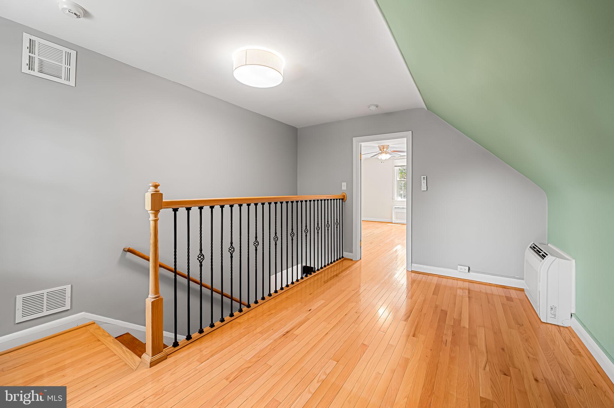 526 Dunkirk Road Baltimore, MD 21212 - Photo 29 of 44 a view of a hallway with wooden floor and a hallway