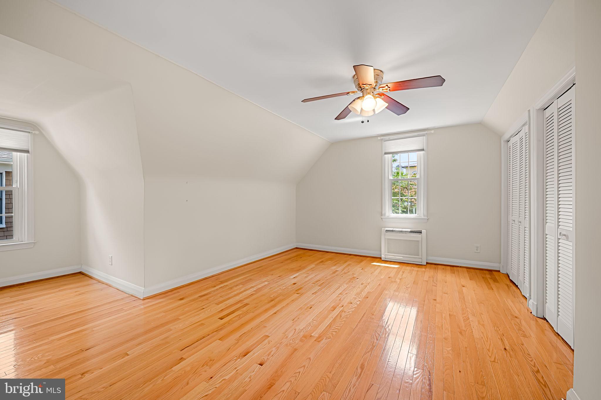 526 Dunkirk Road Baltimore, MD 21212 - Photo 30 of 44 a view of empty room with wooden floor and fan