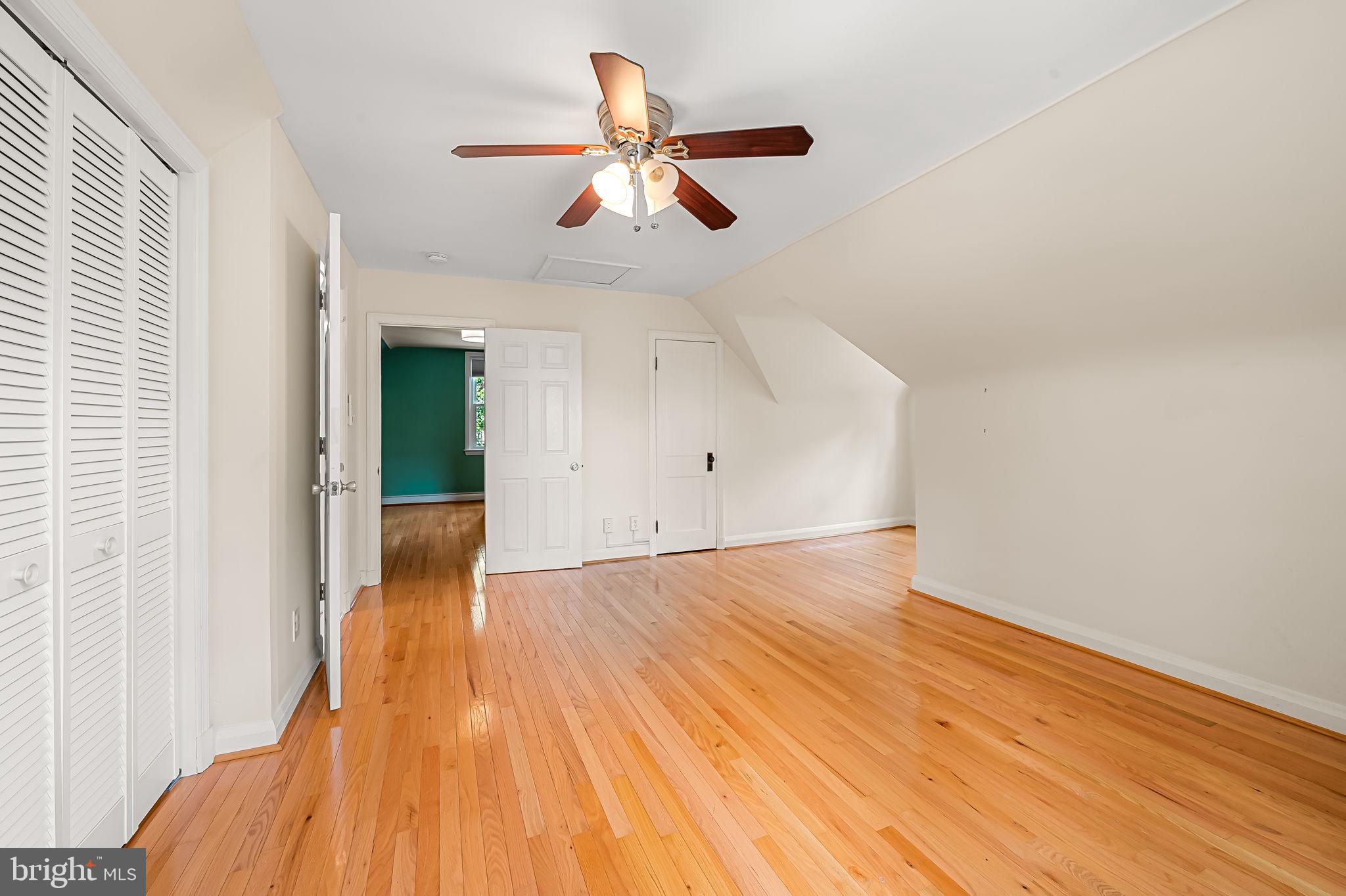 526 Dunkirk Road Baltimore, MD 21212 - Photo 32 of 44 wooden floor in an empty room with a window