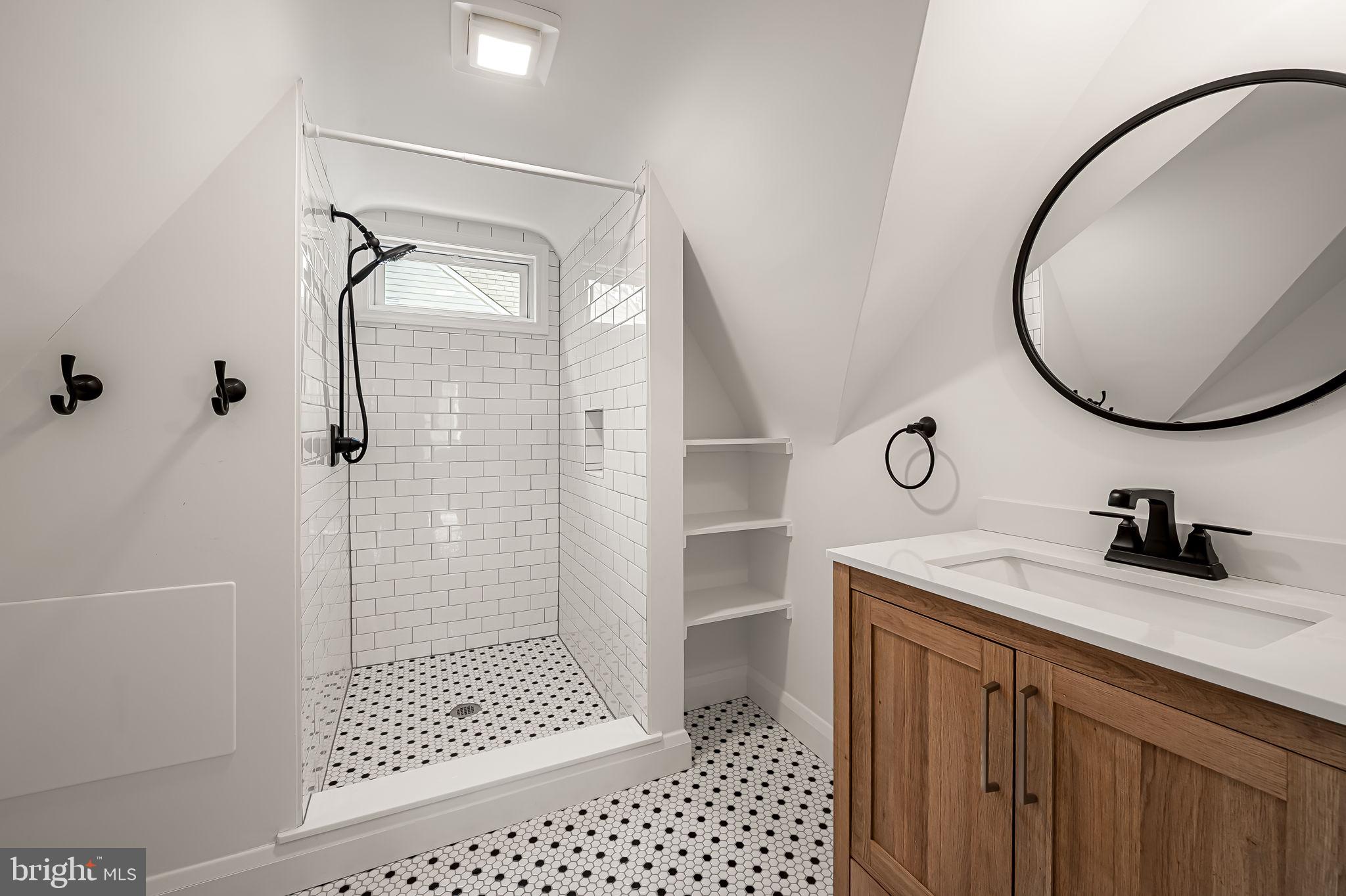 526 Dunkirk Road Baltimore, MD 21212 - Photo 33 of 44 a bathroom with a sink a vanity and a mirror