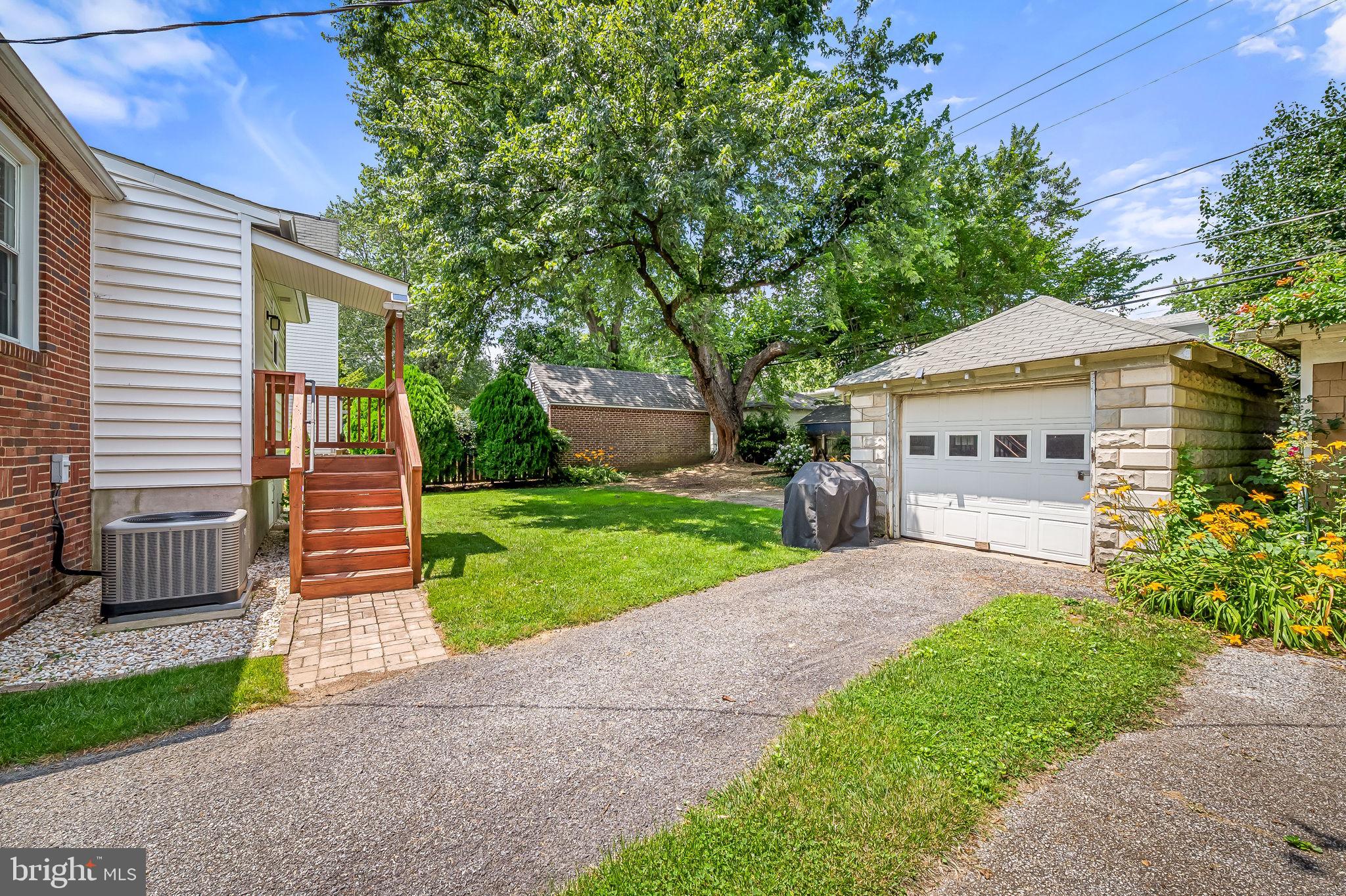 526 Dunkirk Road Baltimore, MD 21212 - Photo 38 of 44 a front view of a house with a garden and trees