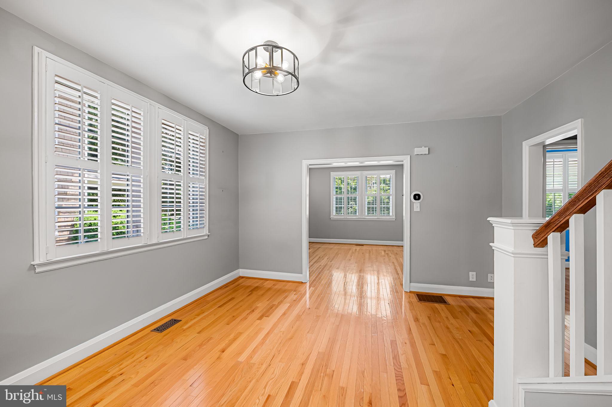 526 Dunkirk Road Baltimore, MD 21212 - Photo 9 of 44 a view of an empty room with wooden floor and a window
