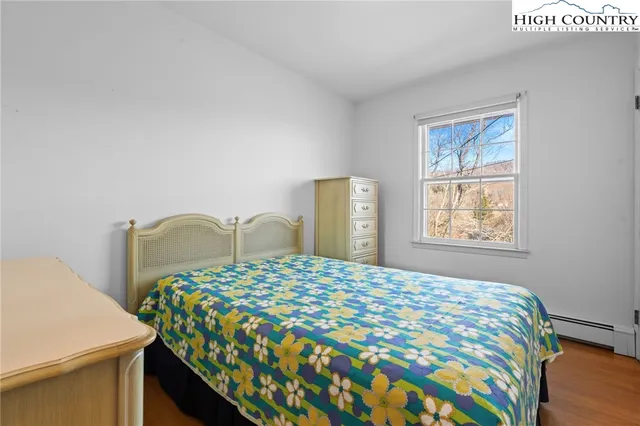 a bedroom with a bed and a table