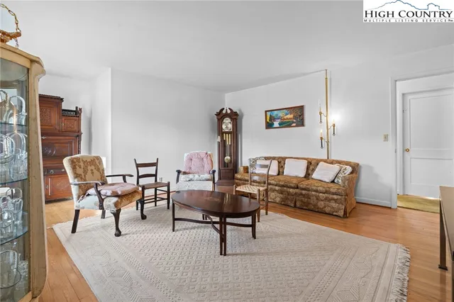 a living room with furniture and a rug