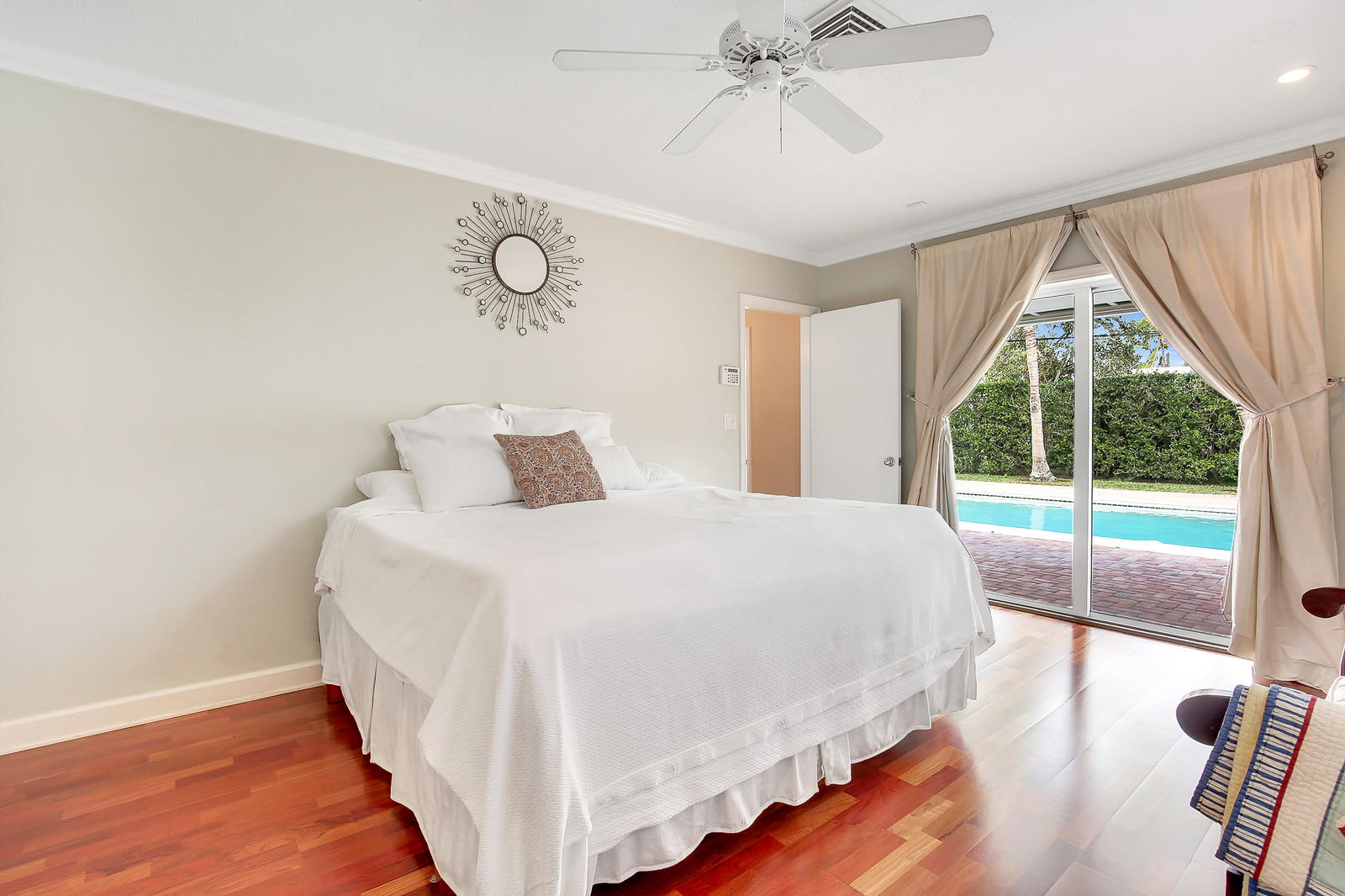 1031 Northwest 6th Street Boca Raton, FL 33486 - Photo 11 of 20 a bedroom with a large bed and a large window