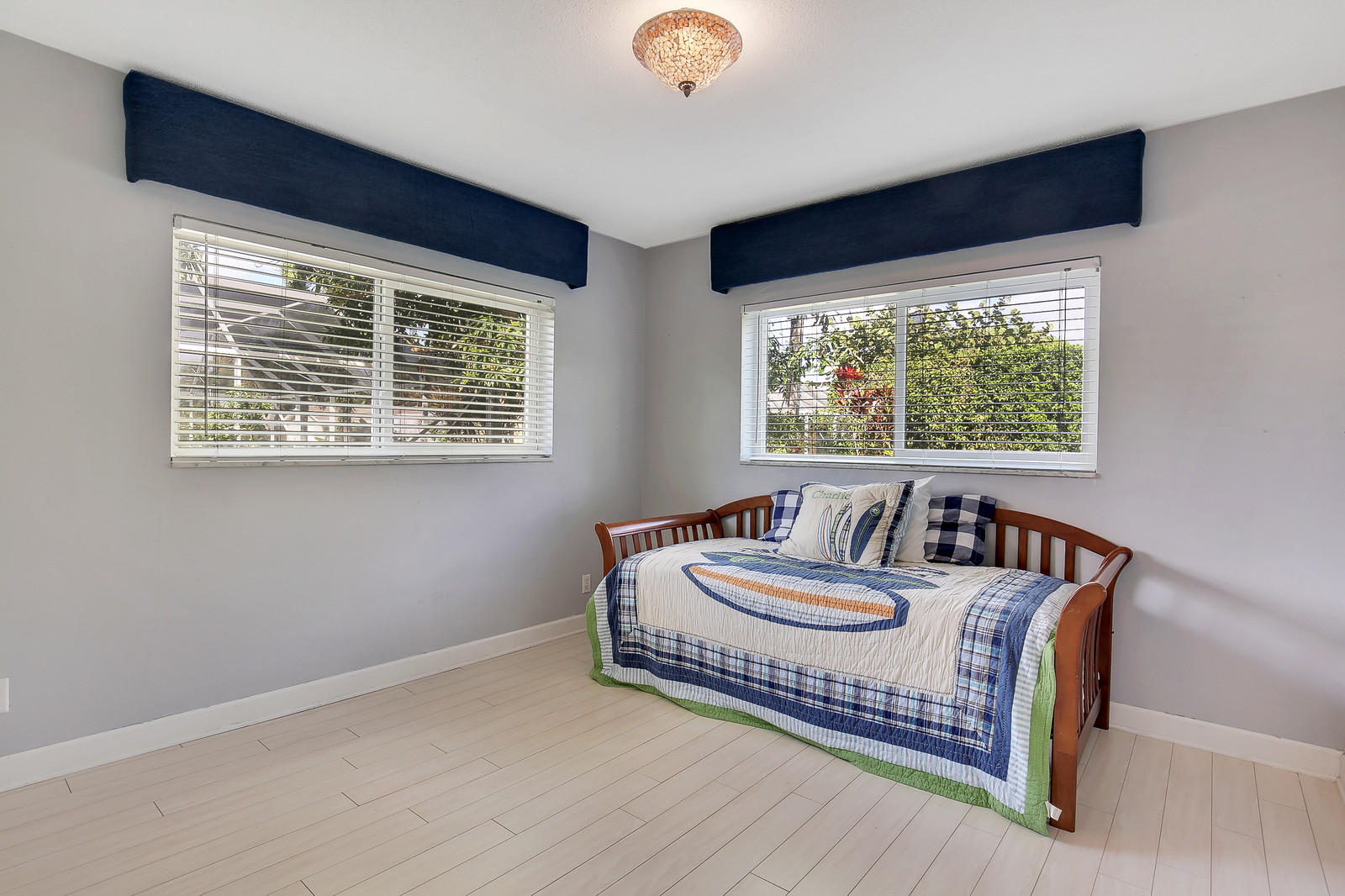 1031 Northwest 6th Street Boca Raton, FL 33486 - Photo 13 of 20 a living room with furniture and a large window
