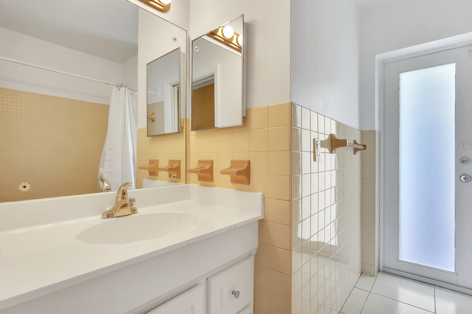 1031 Northwest 6th Street Boca Raton, FL 33486 - Photo 14 of 20 a bathroom with a sink and a mirror