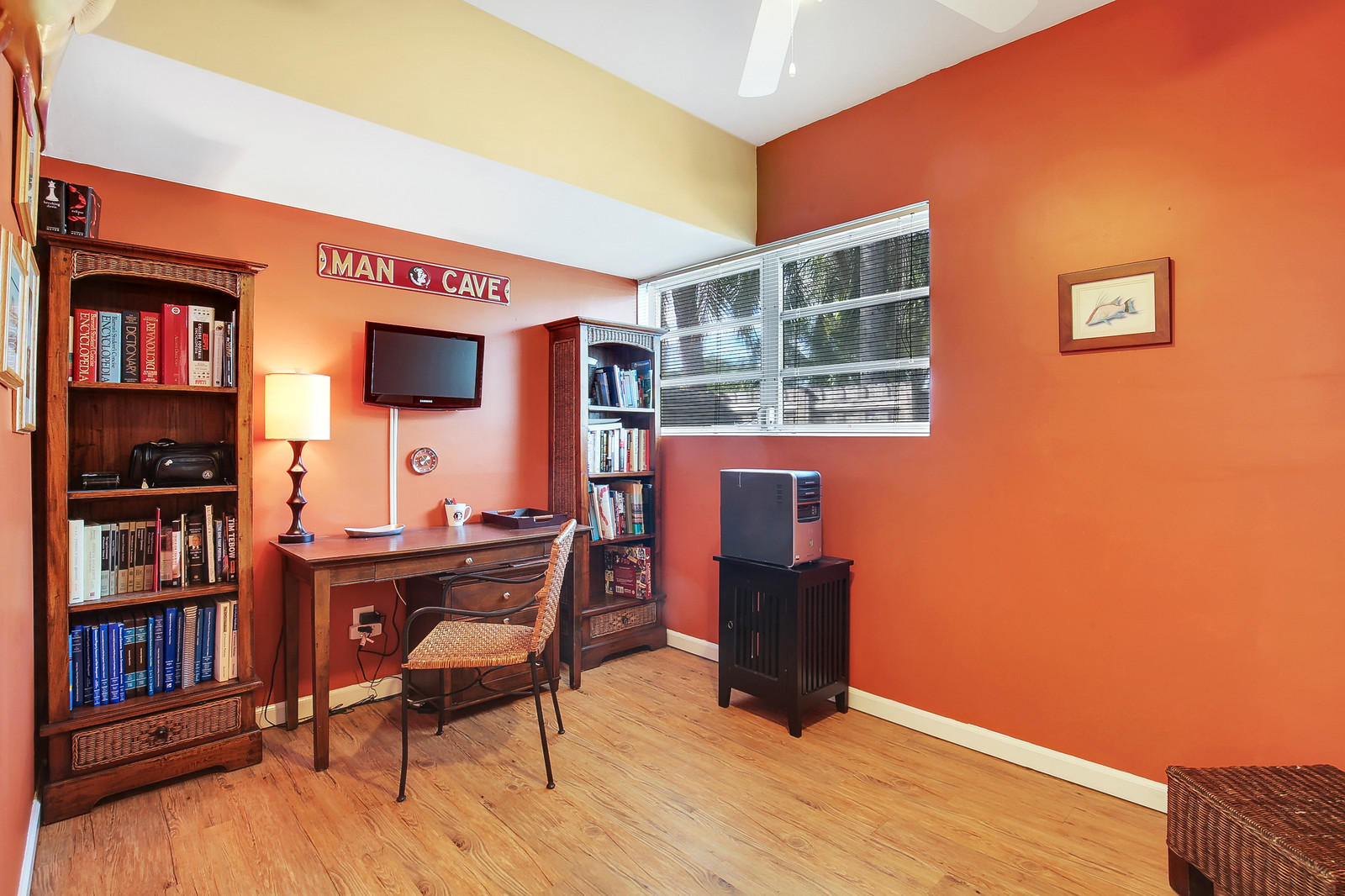 1031 Northwest 6th Street Boca Raton, FL 33486 - Photo 16 of 20 a view of a workspace with furniture and wooden floor