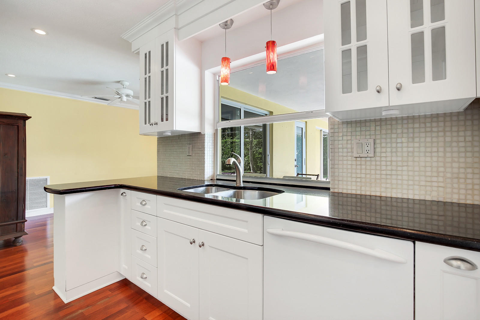 1031 Northwest 6th Street Boca Raton, FL 33486 - Photo 7 of 20 a kitchen with granite countertop white cabinets and white appliances