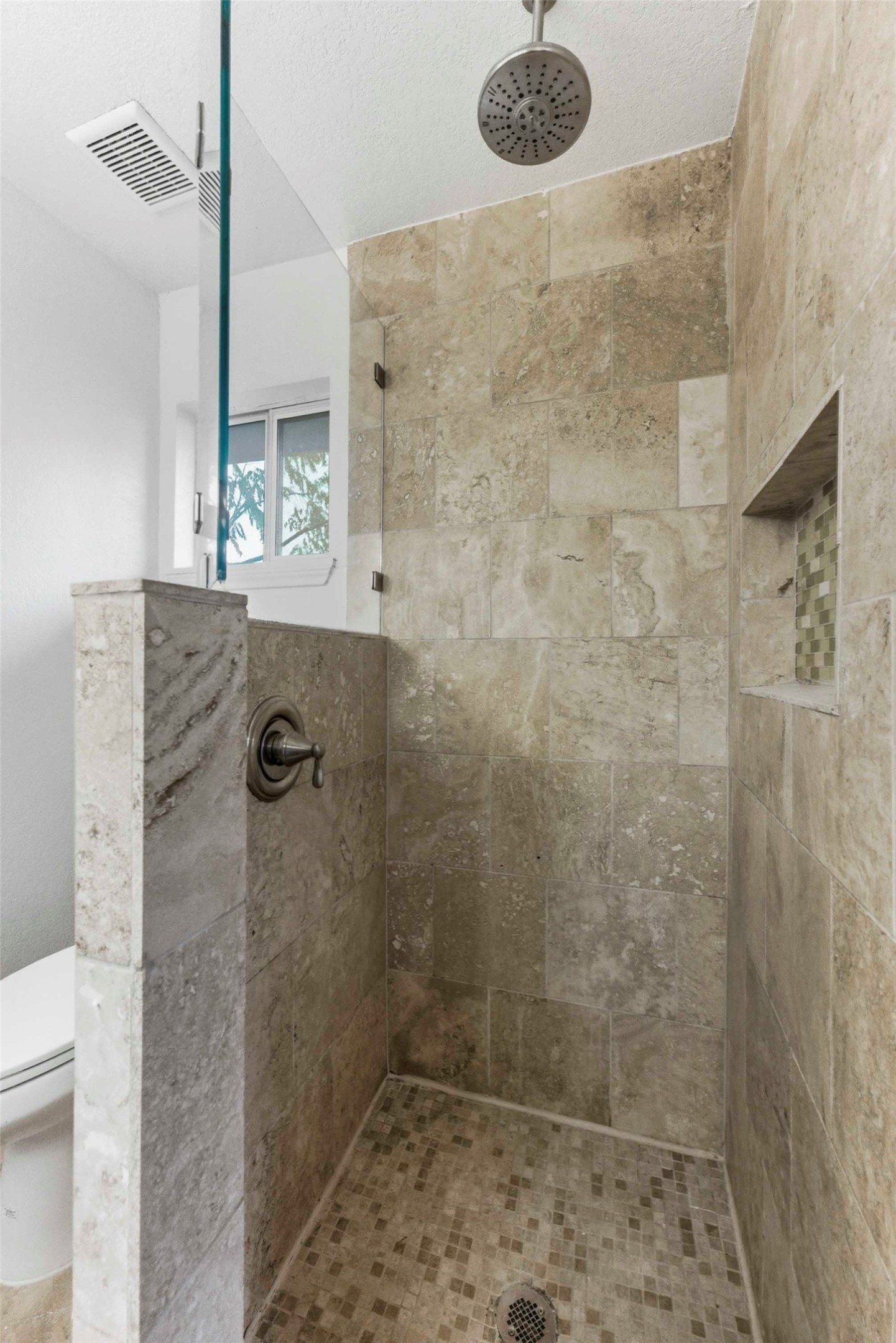 1909 Crooked Lane Austin, TX 78741 - Photo 16 of 25 Bathroom with toilet and a tile shower