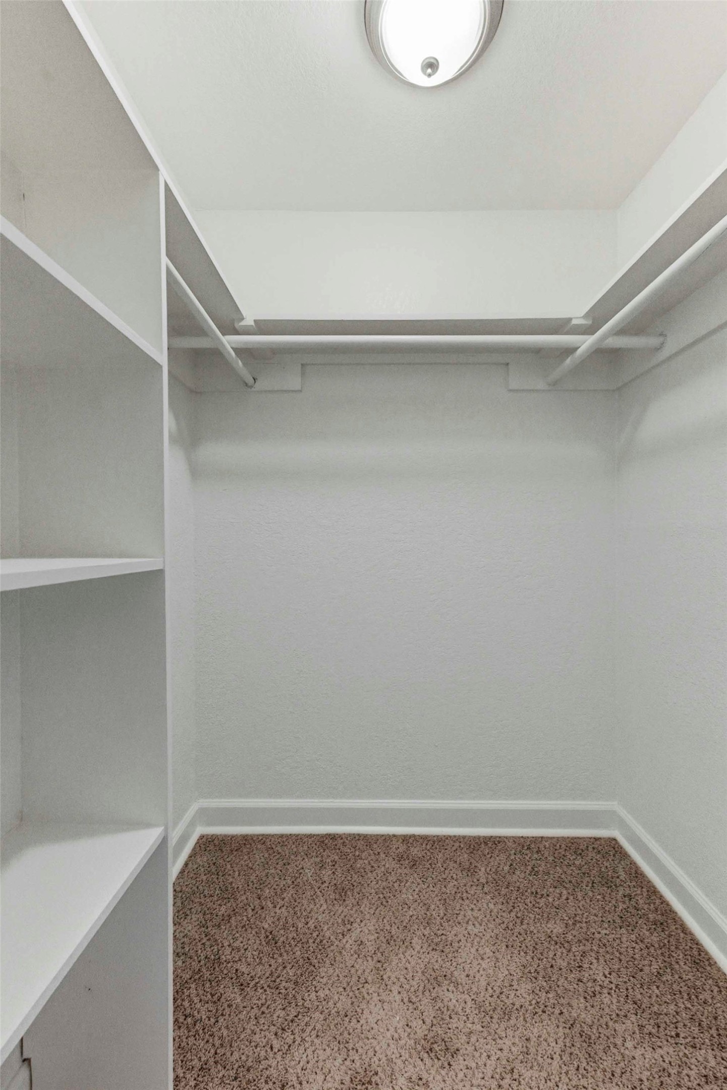 1909 Crooked Lane Austin, TX 78741 - Photo 17 of 25 Spacious closet with dark colored carpet