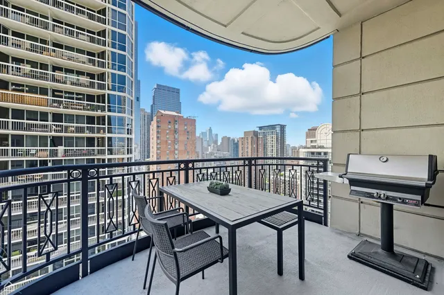 a view of a balcony with chairs