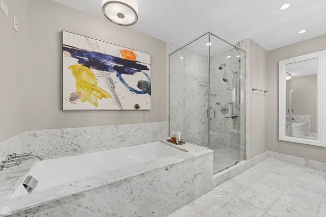 a bathroom with a double vanity sink toilet and shower