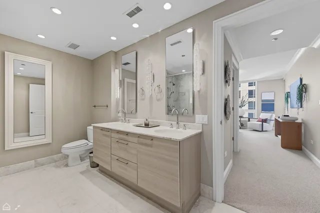 a bedroom with bed and a large window