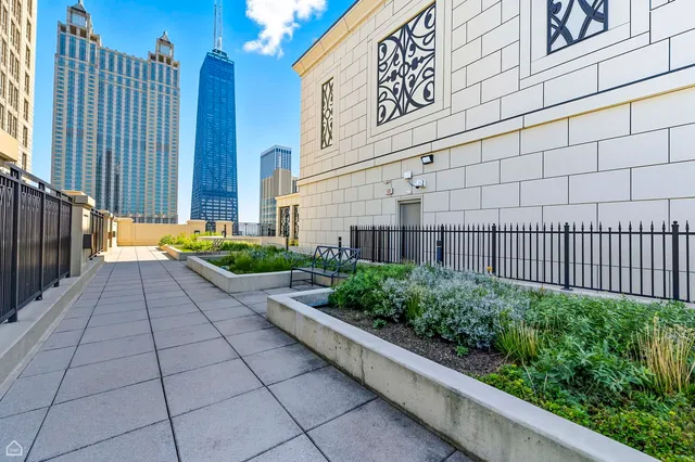 a dining room with furniture and a floor to ceiling window