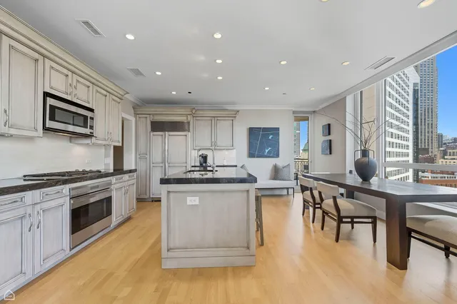 a kitchen with a stove a sink and a microwave