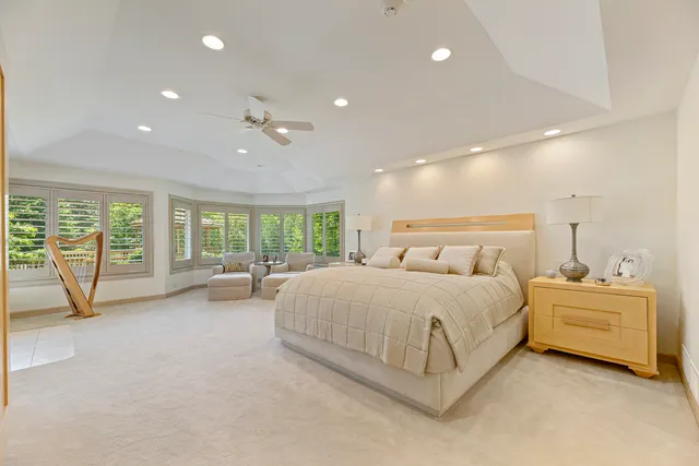 a spacious bathroom with a tub shower and sink
