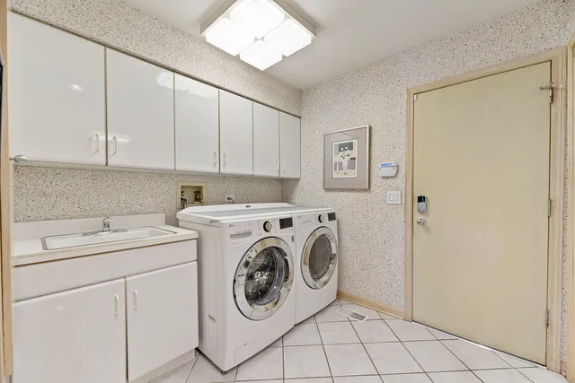 a bathroom with a sink a mirror and a toilet