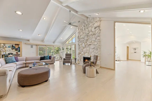 a living room with furniture and white walls