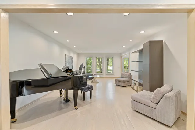 a kitchen with stainless steel appliances granite countertop a sink and a white cabinets