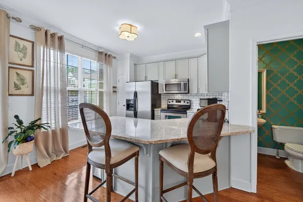 a dining room with furniture and window