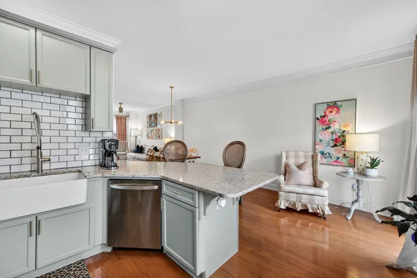 a kitchen with a sink cabinets and appliances