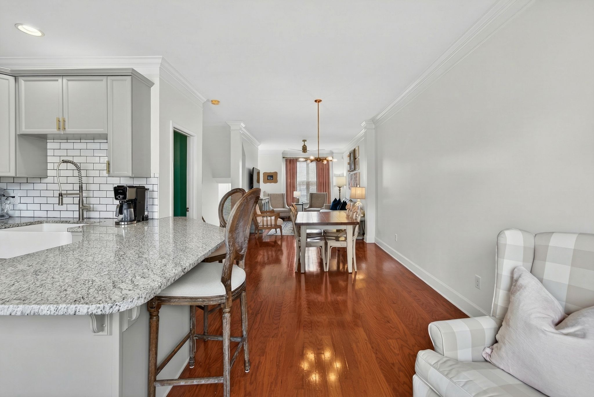 7246 Althorp Way Nashville, TN 37211 - Photo 16 of 34 a kitchen with granite countertop a table chairs stove and kitchen island