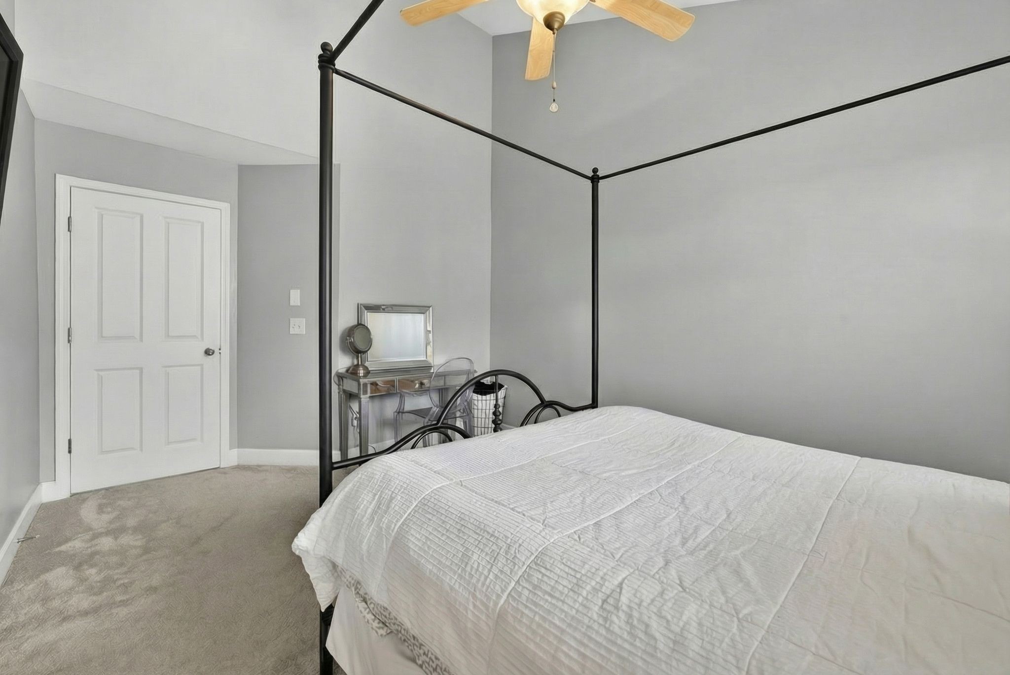 7246 Althorp Way Nashville, TN 37211 - Photo 29 of 34 a bedroom with a bed and a chandelier