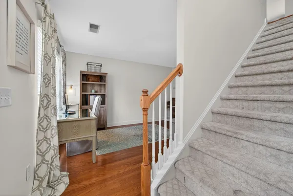 a view of a kitchen with furniture and staircase