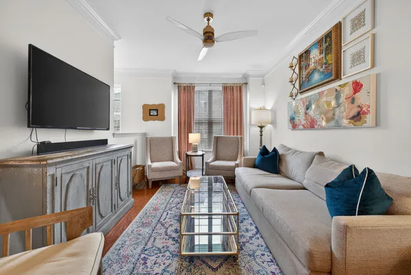 a living room with furniture and a flat screen tv