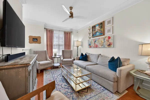 a living room with furniture and a flat screen tv