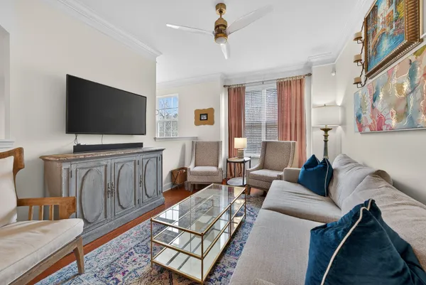 a living room with furniture and a flat screen tv