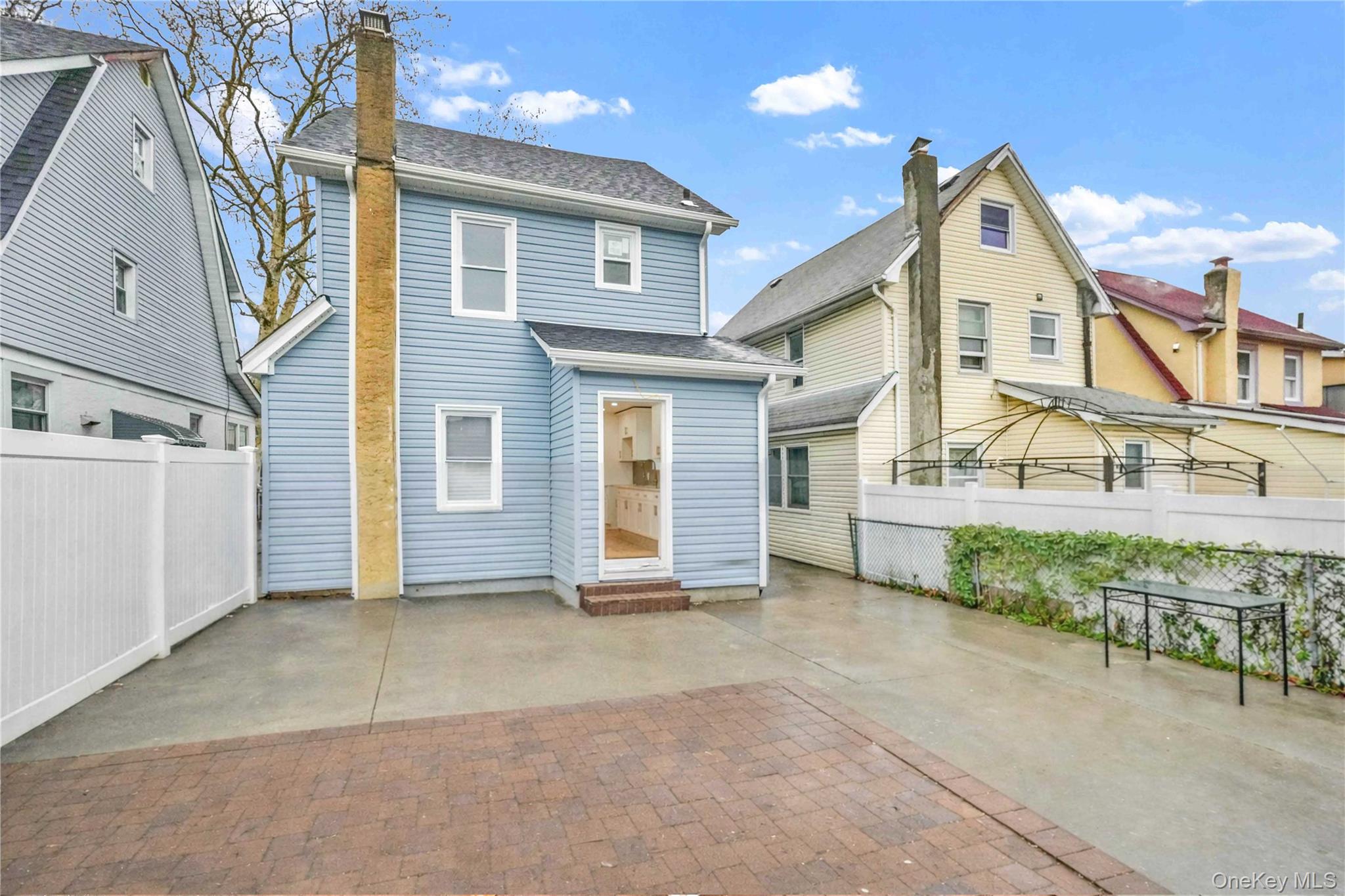 21432 112th Road Queens, NY 11429 - Photo 18 of 18 front view of a house with a yard