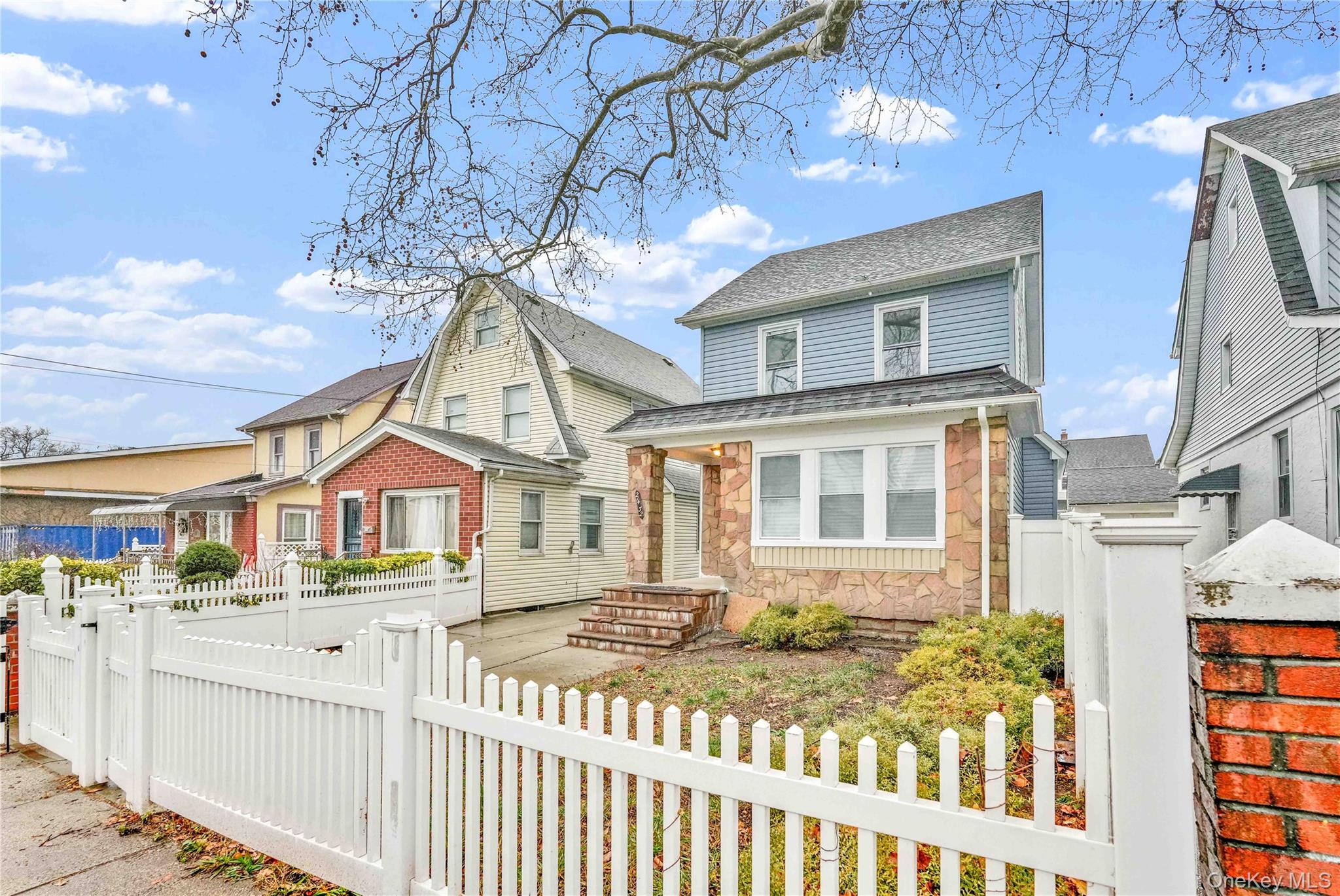 21432 112th Road Queens, NY 11429 - Photo 2 of 18 a front view of a house with a garden