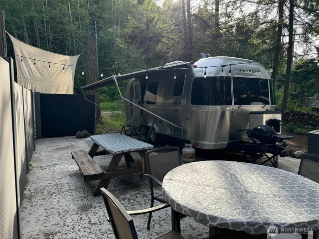 a terrace of a house with table and chairs