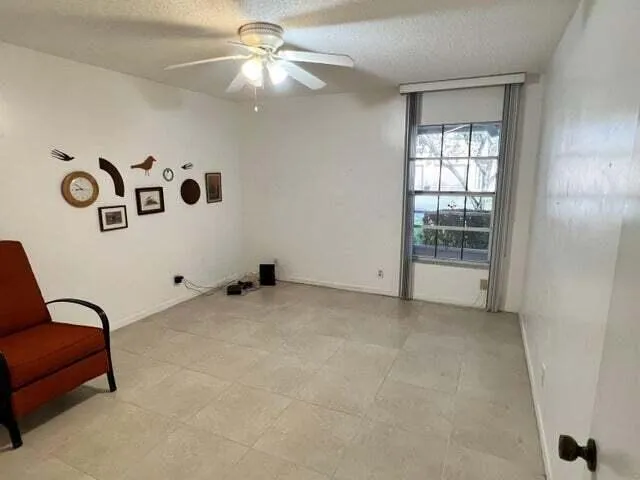 a view of livingroom with furniture and window