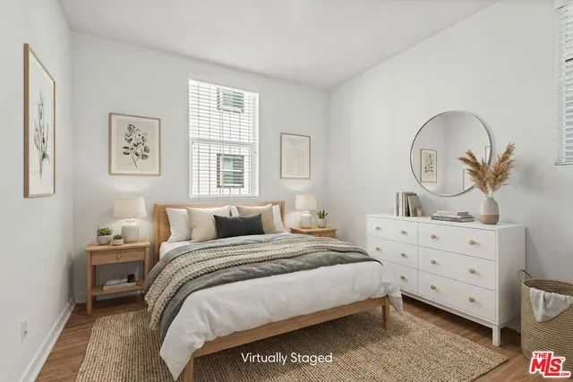 a bedroom with a bed and a dresser