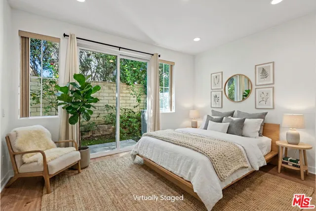 a bedroom with a bed and a chair